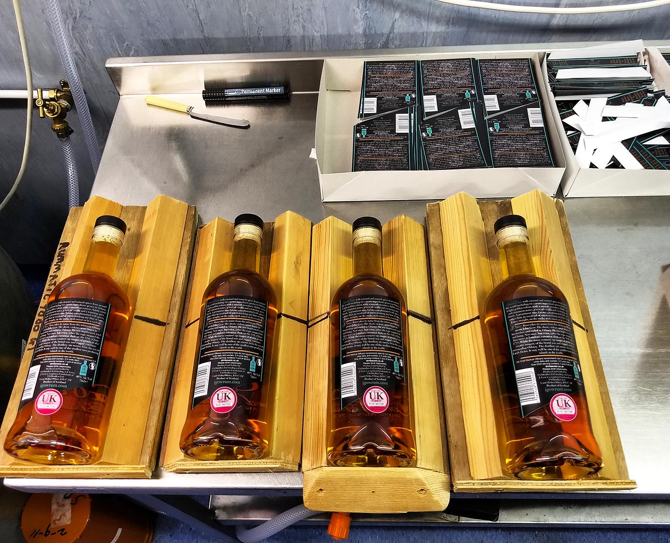 4 bottles of j gow spiced rum hand labelled