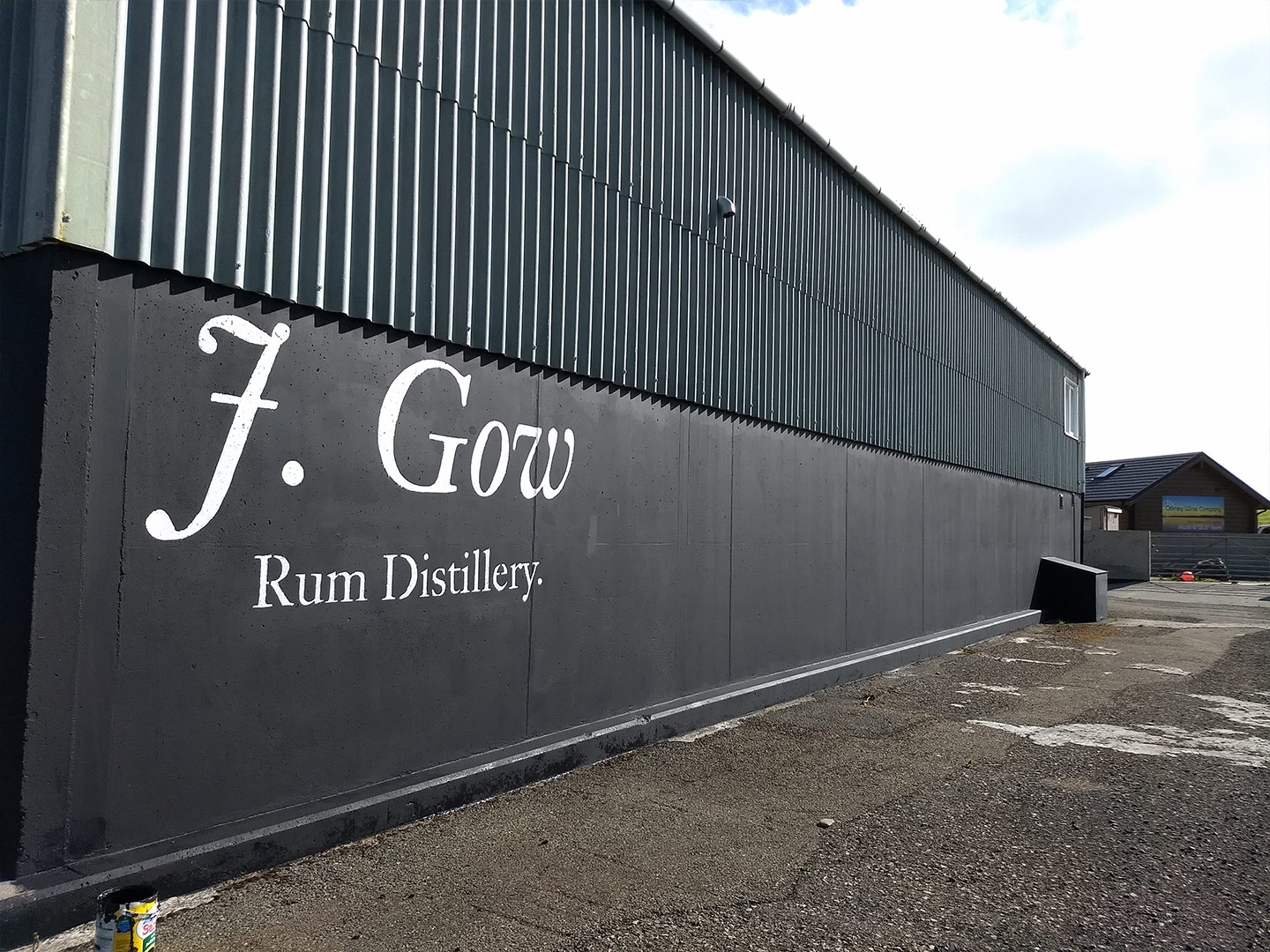 j gow rum distillery being painted
